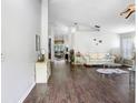 Inviting living room with wood floors, neutral walls, and an open layout perfect for modern living and entertaining at 10231 Millport Dr, Tampa, FL 33626