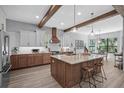 Gourmet kitchen with a large island, stainless steel appliances, and custom cabinetry at 12705 Green Heron Way, Odessa, FL 33556