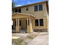 Charming two-story home with inviting front porch and classic architectural details, a perfect blend of comfort and style at 1435 17Th N Ave, St Petersburg, FL 33704
