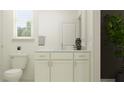 Well lit bathroom showcases a single sink vanity with sleek finishes and hardware and a decorative plant at 18461 Serene Lake Loop, Lutz, FL 33548