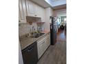 Well-maintained kitchen with granite countertops and stainless steel appliances at 1898 Shore S Dr # 311, South Pasadena, FL 33707