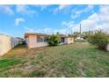 Expansive backyard offers ample space for outdoor activities and relaxation at 3243 Eisenhower Dr, Holiday, FL 34691