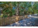 Landscaped yard with picket fence enhances the curb appeal of this charming home at 330 Lang N Ct # 1, St Petersburg, FL 33701