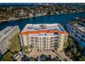 An aerial view of the condo building with a view of the water at 3805 Gulf Blvd # 504, St Pete Beach, FL 33706