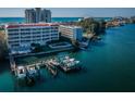Aerial view of the community with a dock and multiple slips at 3805 Gulf Blvd # 504, St Pete Beach, FL 33706