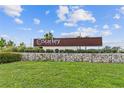 Starkey Ranch community entrance sign with stone accents and lush green landscaping at 3877 Burdick Loop, Odessa, FL 33556