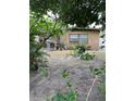 A framed view of a house with a teal door and brown trim at 4104 W North B St, Tampa, FL 33609