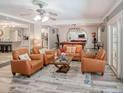 Stylish living room featuring comfortable seating, and easy access to kitchen and billiards room at 5153 Miller Bayou Dr, Port Richey, FL 34668