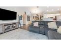 Cozy living room features modern furnishings and wood flooring at 5666 Gardens Dr # 202, Sarasota, FL 34243