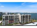 Waterfront condo exterior view with balcony, and gorgeous bay views in Sarasota, Florida at 100 Oakmont Ln # 305, Belleair, FL 33756