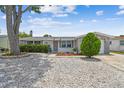 Charming single-story home with stone accents and a well-maintained front yard at 1150 Grand Blvd, Holiday, FL 34690