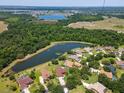 An aerial view reveals the neighborhood's serene setting amidst the natural beauty of the area at 12309 Creek Edge Dr, Riverview, FL 33579