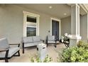 Cozy front porch with comfortable seating, a modern fire pit, and tasteful decor at 16115 Mount Holly Dr, Bradenton, FL 34211