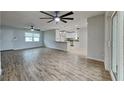 Inviting living room featuring a breakfast bar and direct access to the kitchen and dining area at 1701 Hibiscus S Cir, Oldsmar, FL 34677