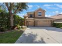 Charming two-story home with a large driveway and well-manicured landscaping at 17809 Sandpine Trace Way, Tampa, FL 33647