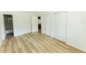This bedroom features bright light, new flooring, and a double closet at 213 Red Cedar Pl # 213, Brandon, FL 33510