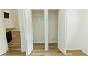 Open, well-lit walk-in closet with ample space for storage at 213 Red Cedar Pl # 213, Brandon, FL 33510