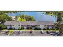 Scenic aerial view of townhomes with lake backdrop and convenient parking at 2557 Cedar Cypress Ct, Tampa, FL 33618
