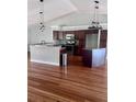 Gourmet kitchen features stainless steel appliances, granite countertops and hardwood floors at 2841 S Cranberry Blvd, North Port, FL 34286
