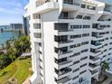 Stunning view of this modern white condo building with multiple balconies overlooking the waterfront at 30 Turner St # 704, Clearwater, FL 33756