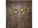 Wooden double front door adorned with decorative wreaths, enhancing the home's welcoming appeal at 3200 Sandy Ridge Dr, Clearwater, FL 33761