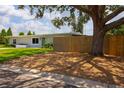 Charming single-story home with fenced in yard and mature trees providing lots of shade at 3951 72Nd N St, St Petersburg, FL 33709