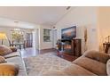 Inviting living room featuring hardwood floors, a cozy fireplace, and natural light at 4555 Hannah Ln, St Petersburg, FL 33709