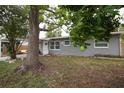 Cozy single-story home with mature trees and a well-maintained front yard creating a peaceful setting at 5205 98Th N Ter, Pinellas Park, FL 33782
