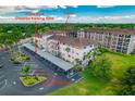 Beautiful condo building with two assigned parking spots and a porch at 6150 Gulfport S Blvd # 302, Gulfport, FL 33707