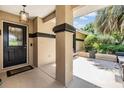 Inviting front porch with an accent door and plenty of space at 6436 Huntington Dr, Zephyrhills, FL 33542