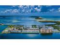 Breathtaking aerial view of the waterfront property with stunning views of the ocean and coastline at 8 Glencoe Pl # 305, Dunedin, FL 34698