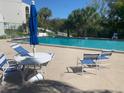 Relaxing pool area with comfortable seating, perfect for enjoying sunny days and leisure at 2625 State Road 590 # 2832, Clearwater, FL 33759