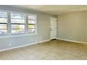 Bright living room featuring tile floors, neutral walls and natural light at 4214 Fairfield S Ave, St Petersburg, FL 33711