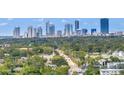 Scenic aerial view of downtown cityscape skyline beyond lush green trees and a road at 4651 1St Ne St # 402, St Petersburg, FL 33703