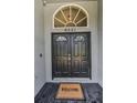 Inviting front entrance with double doors and transom window at 6521 Oelsner St, New Port Richey, FL 34652
