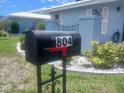 Close up of the mailbox at 804, showing the manicured lawn and well-maintained landscaping at 804 67Th W St, Bradenton, FL 34209