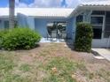 Outdoor patio with chairs offers a cozy spot for relaxation and outdoor entertaining at 804 67Th W St, Bradenton, FL 34209