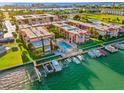 Gorgeous waterfront condo complex featuring a community pool and convenient boat docks at 8921 Blind Pass Rd # 142, St Pete Beach, FL 33706