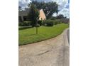 Well-kept lawn and landscaping surrounding this home at 9302 Trowbridge Ct, New Port Richey, FL 34655