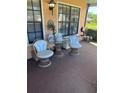 Cozy porch with seating area, perfect for relaxing outdoors at 9302 Trowbridge Ct, New Port Richey, FL 34655