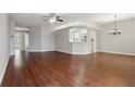 A spacious living room with hardwood floors and lots of natural light at 9329 Huntington Park Way, Tampa, FL 33647