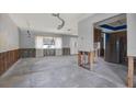 Spacious living room with large windows, showcasing the potential for renovation and customization at 11628 Grove St, Seminole, FL 33772