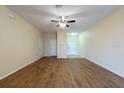 Bright living area with wood flooring, recessed lights, and multiple entryways at 11903 Greengate Dr, Hudson, FL 34669