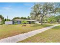 Charming single-story home with a well-maintained lawn at 1607 Melodie Dr, Brandon, FL 33510