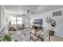 Bright living room featuring neutral tones, modern decor, and ample natural light at 2575 Granada E Cir, St Petersburg, FL 33712