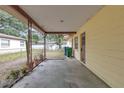 Large covered porch with plenty of room for seating and relaxing at 2724 W Henry Ave, Tampa, FL 33614