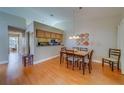 Dining room boasts wood floors and decorative wall plates at 2749 Countryside Blvd # 4, Clearwater, FL 33761