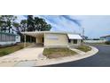 Charming single-story home features a covered parking area and a well-maintained front yard at 3301 Alt 19 # 500, Palm Harbor, FL 34683