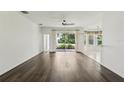 Sunlit living room featuring a glass sliding door for easy access to backyard at 3311 Stonebridge Trl, Valrico, FL 33596