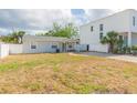 Charming single-story home next to a new modern home with a well-maintained yard at 4714 W Lawn Ave, Tampa, FL 33611